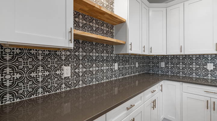 Black and white patterned tiled scullery walls