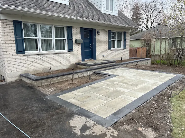 Large-format patio slabs with a charcoal border